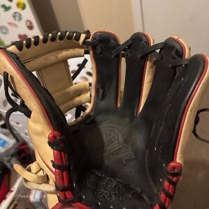 Black and Cream Baseball Glove with Red Accents